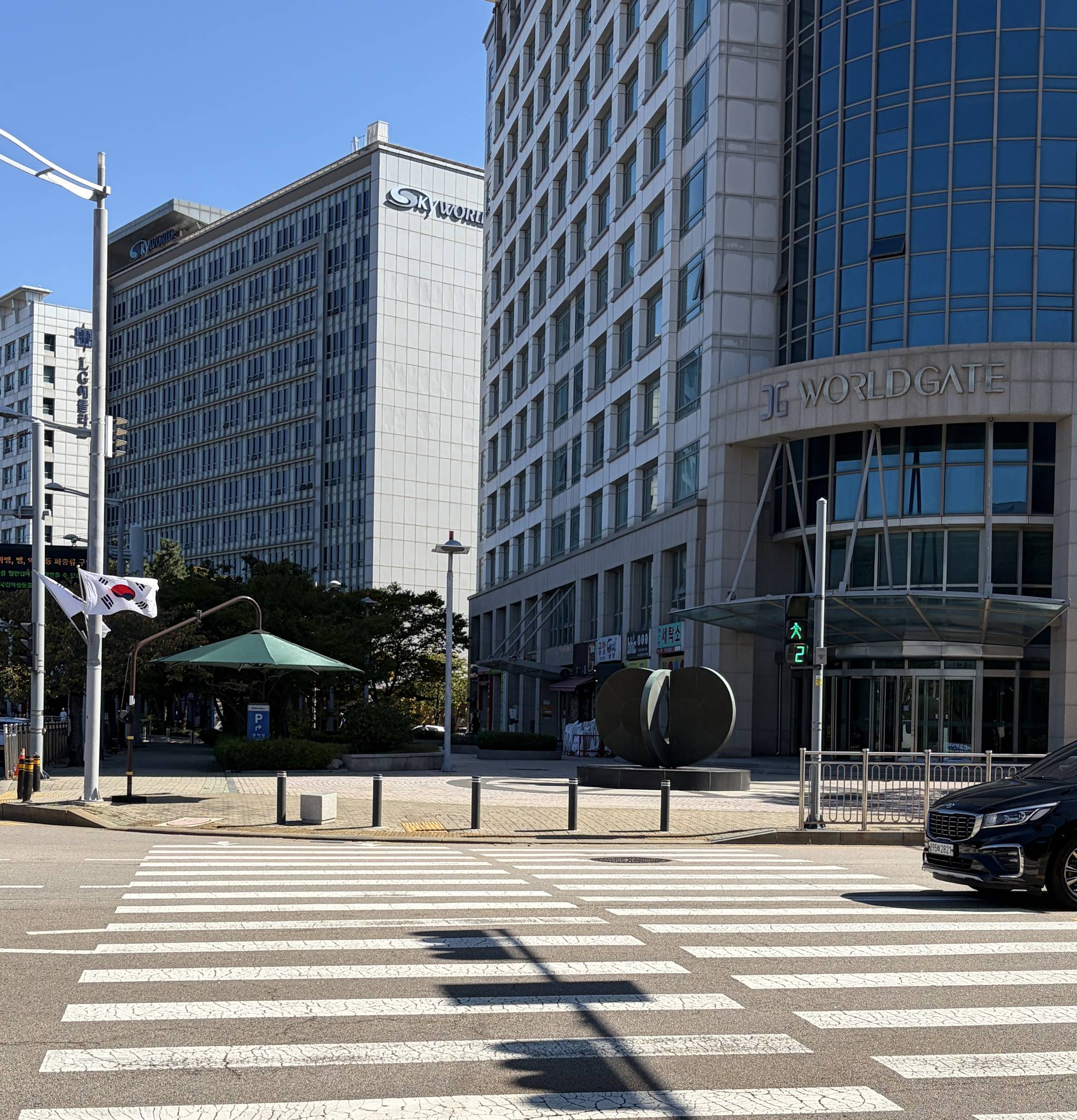 The crosswalk in front of our building — cross here